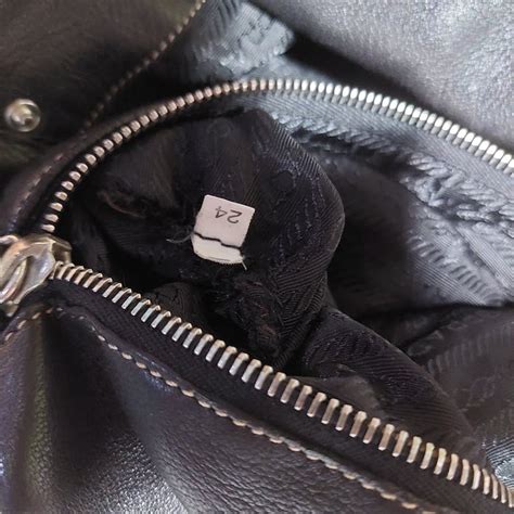 prada zip engraved is ipi|Prada purse zip.